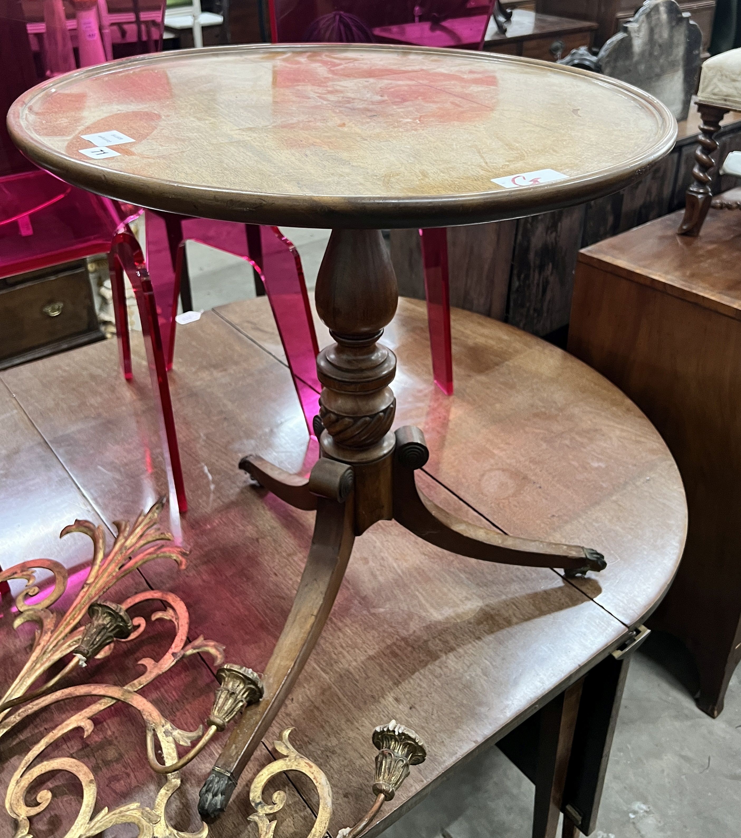 A Regency circular mahogany tilt top tripod tea table, diameter 63cm, height 71cm